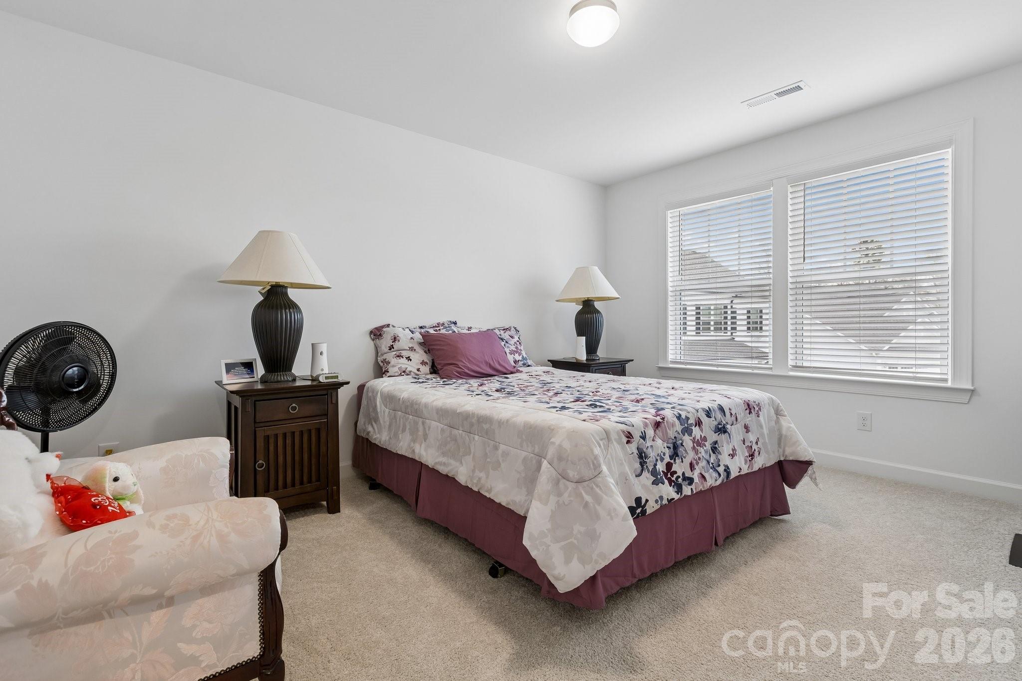 911 Cypress Point Lane Monroe, NC 28112 - Photo 24 of 37 a bedroom with a bed and wooden floor