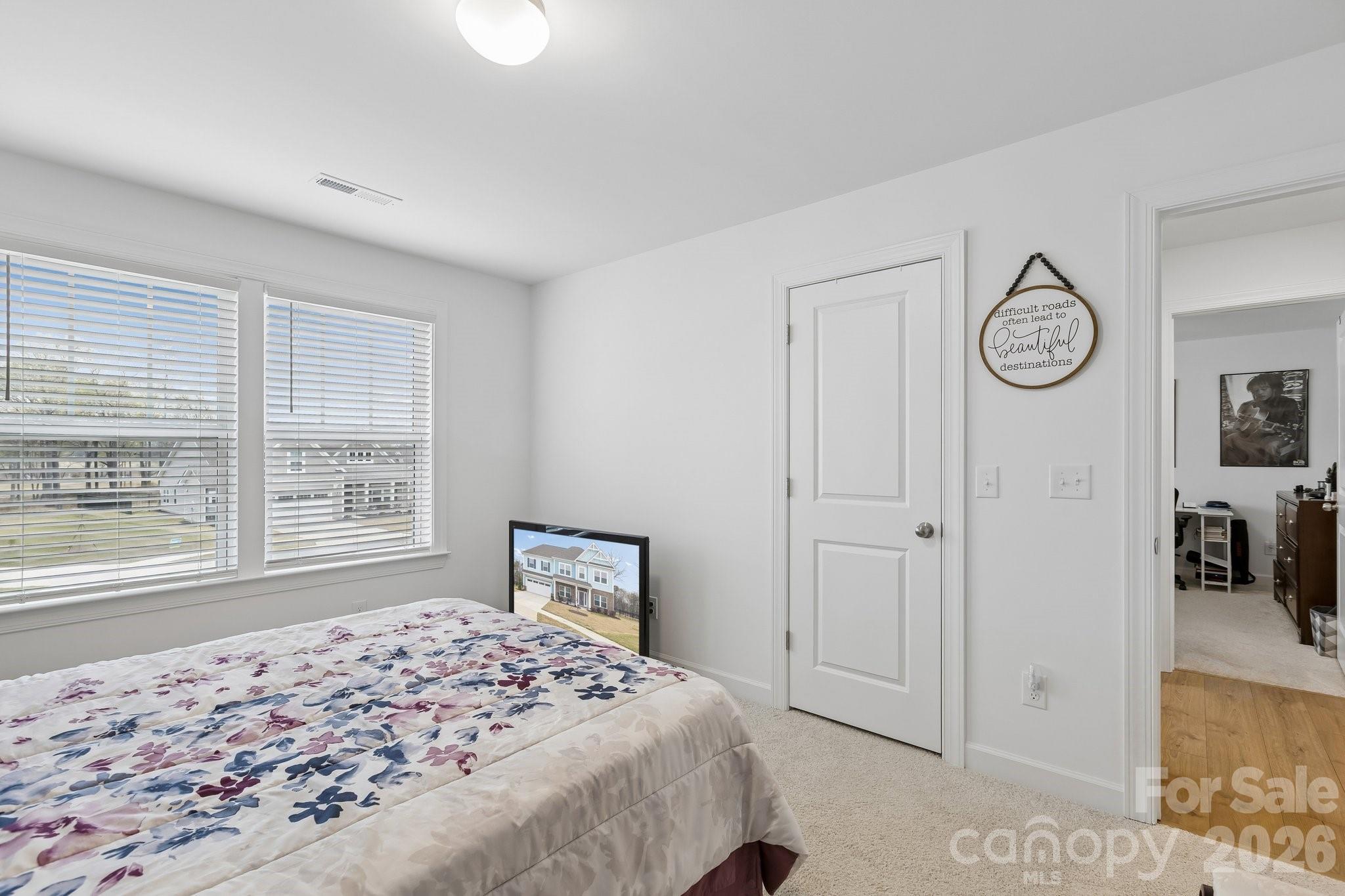 911 Cypress Point Lane Monroe, NC 28112 - Photo 25 of 37 a bedroom with a bed and a window