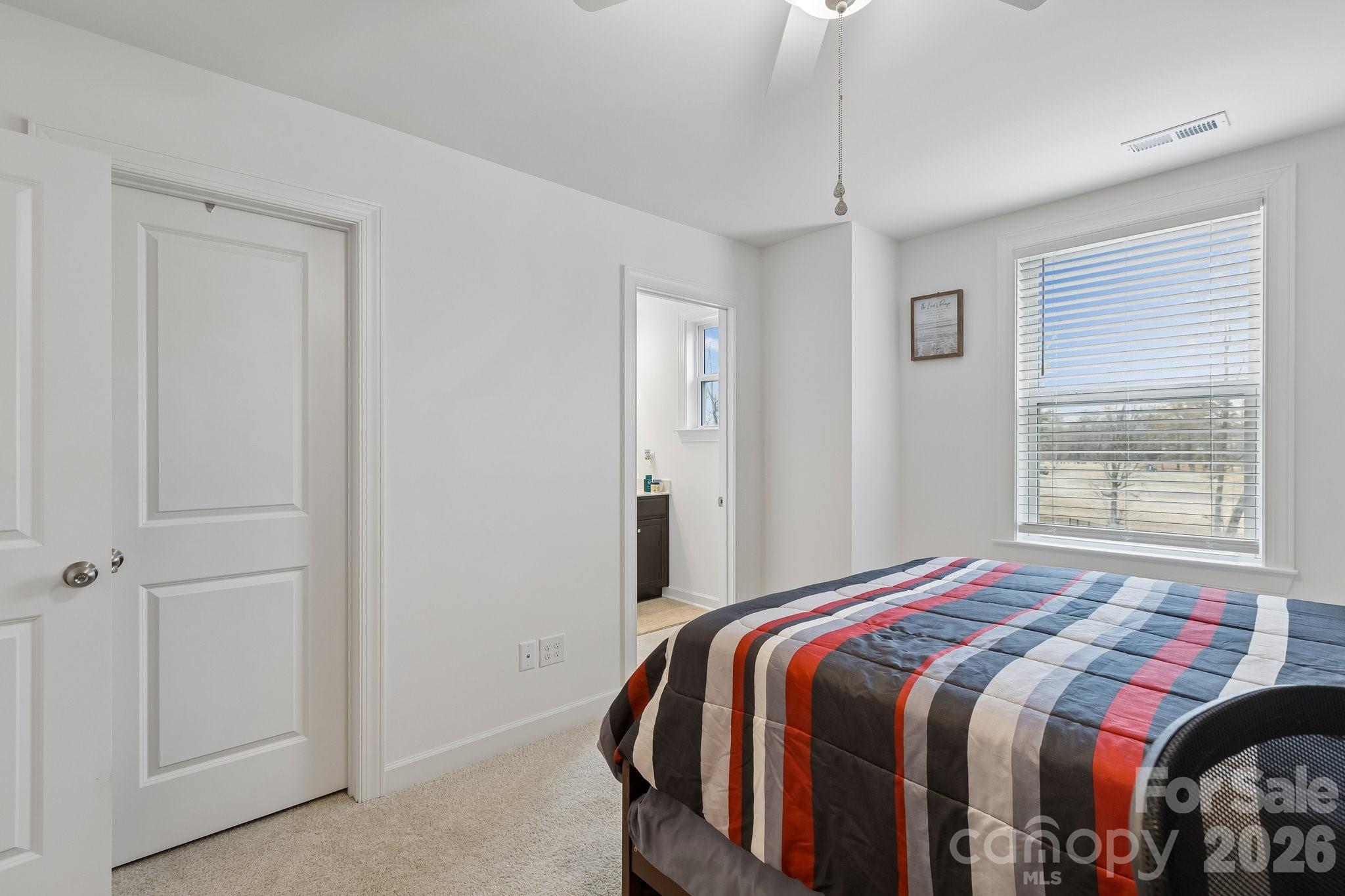 911 Cypress Point Lane Monroe, NC 28112 - Photo 27 of 37 a bedroom with a bed and a window