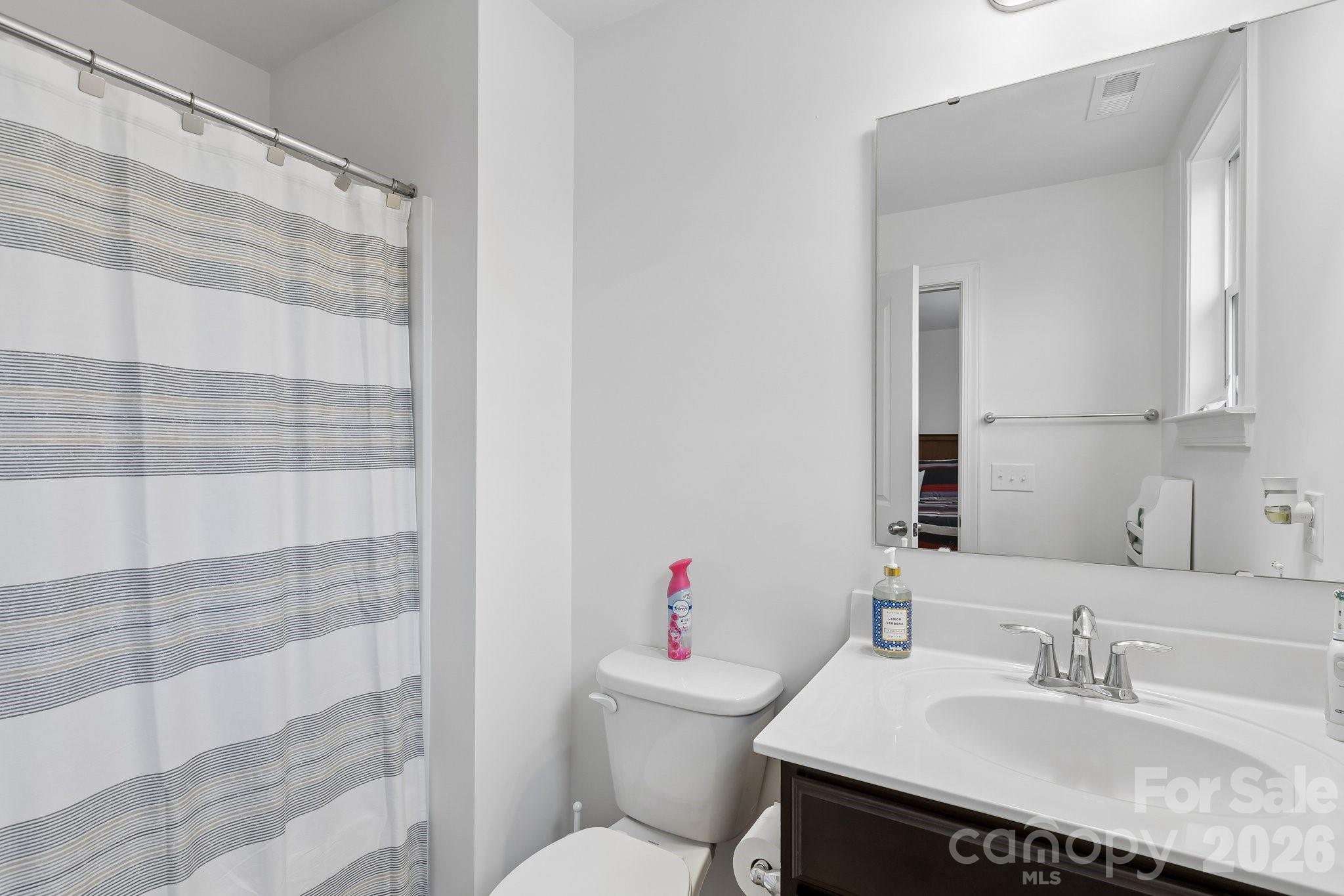 911 Cypress Point Lane Monroe, NC 28112 - Photo 28 of 37 a bathroom with a sink toilet and shower