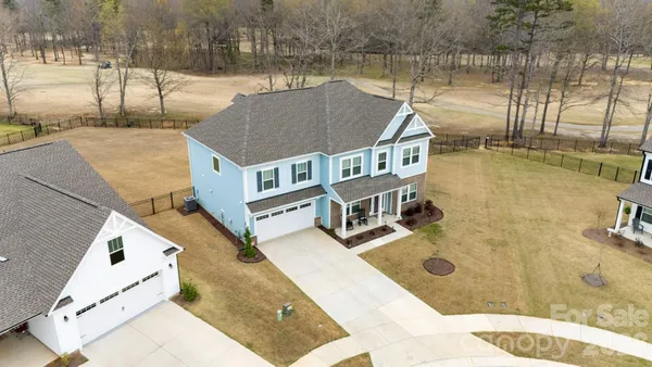 a house view with a lake view