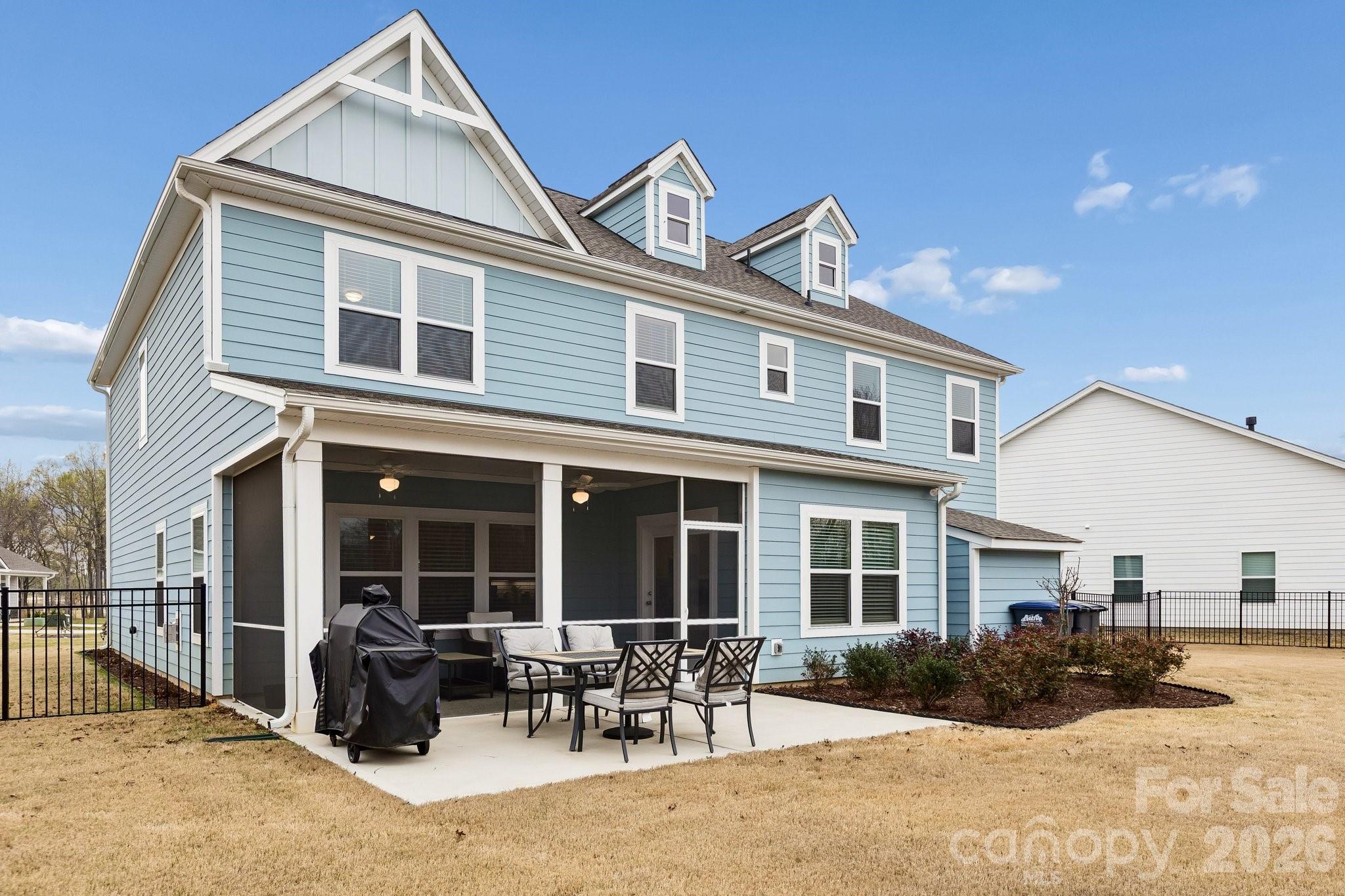 911 Cypress Point Lane Monroe, NC 28112 - Photo 32 of 37 a front view of a house with outdoor seating and barbeque oven