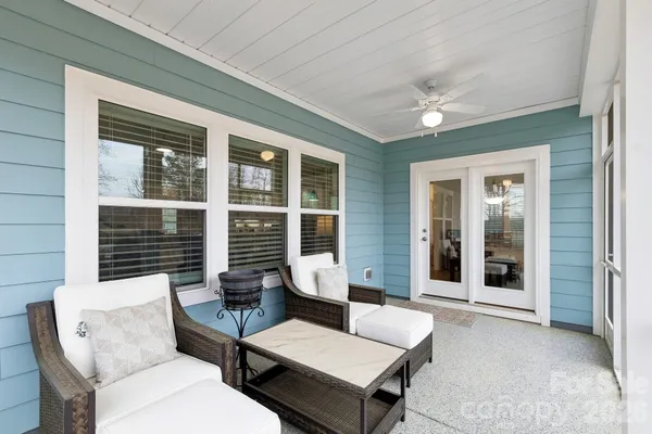 a outdoor living space with furniture and a potted plant