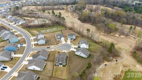 an aerial view of a house with outdoor space