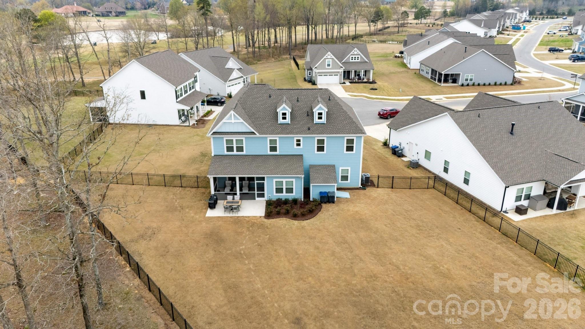 911 Cypress Point Lane Monroe, NC 28112 - Photo 37 of 37 an aerial view of a house with large trees