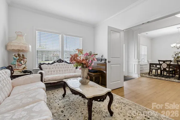a living room with furniture and a table