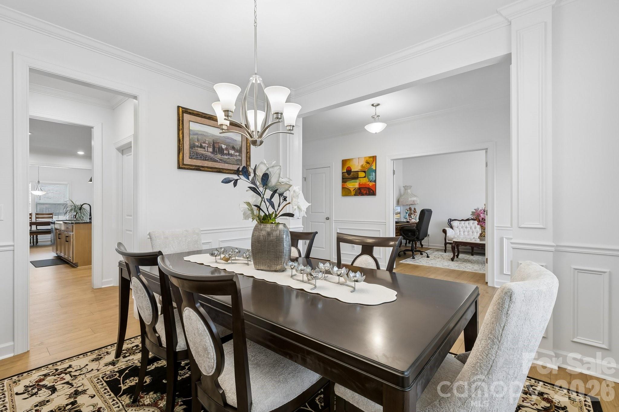911 Cypress Point Lane Monroe, NC 28112 - Photo 5 of 37 a view of a dining room with furniture and wooden floor
