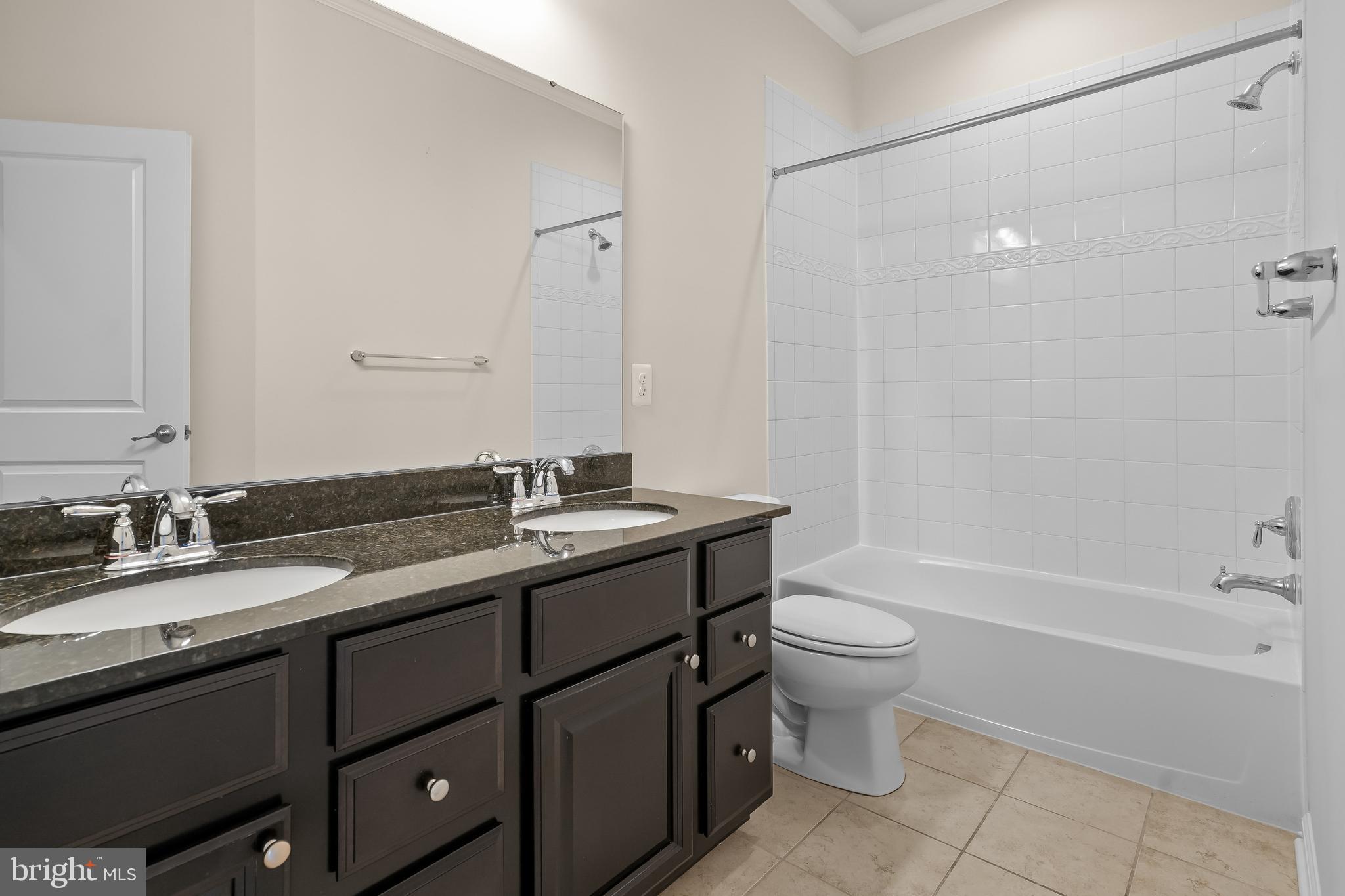 336 Chessington Drive Odenton, MD 21113 - Photo 21 of 24 a bathroom with a double vanity sink toilet and shower