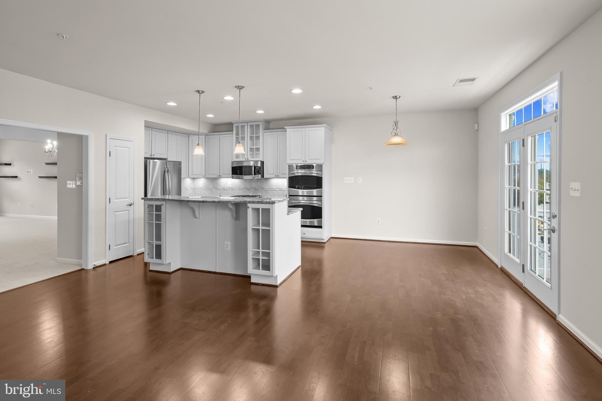 336 Chessington Drive Odenton, MD 21113 - Photo 7 of 24 a view of kitchen with wooden floor and window