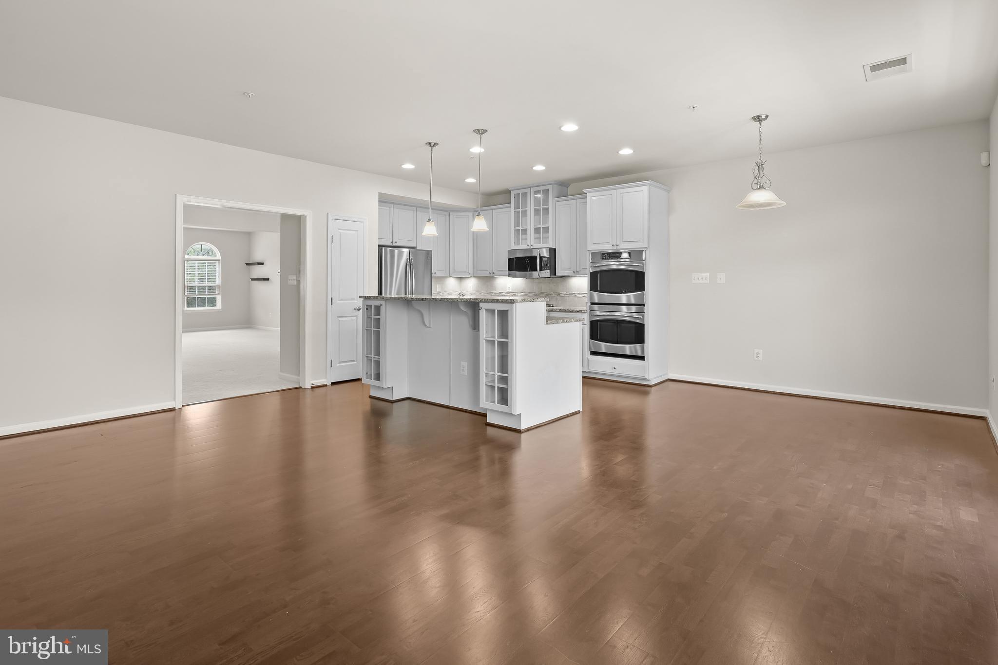 336 Chessington Drive Odenton, MD 21113 - Photo 8 of 24 a view of kitchen with wooden floor and window