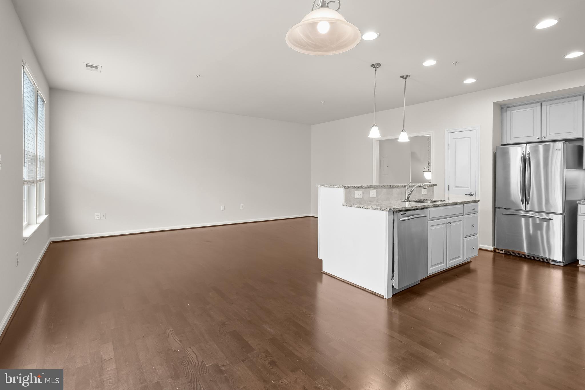 336 Chessington Drive Odenton, MD 21113 - Photo 9 of 24 a kitchen with stainless steel appliances a refrigerator and a stove top oven