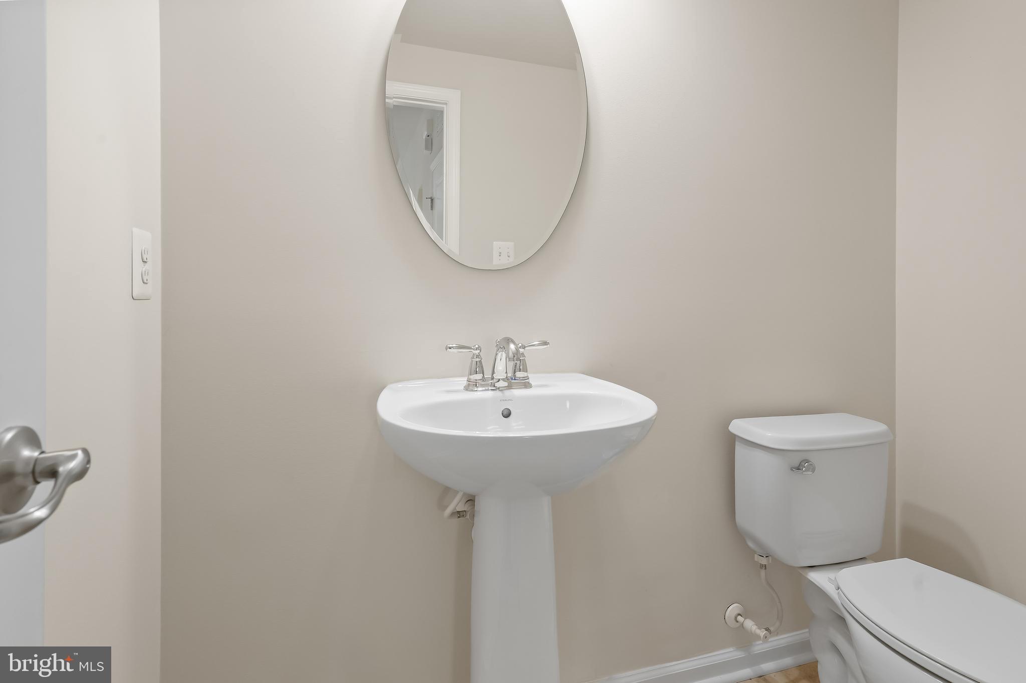 336 Chessington Drive Odenton, MD 21113 - Photo 10 of 24 a bathroom with a toilet a sink and a mirror