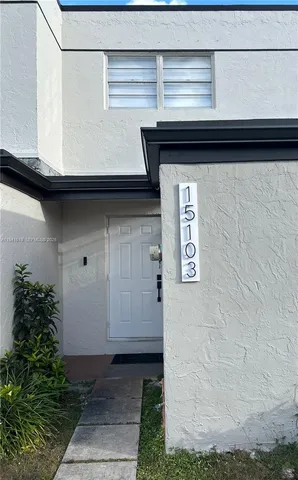 a front view of a house with garage