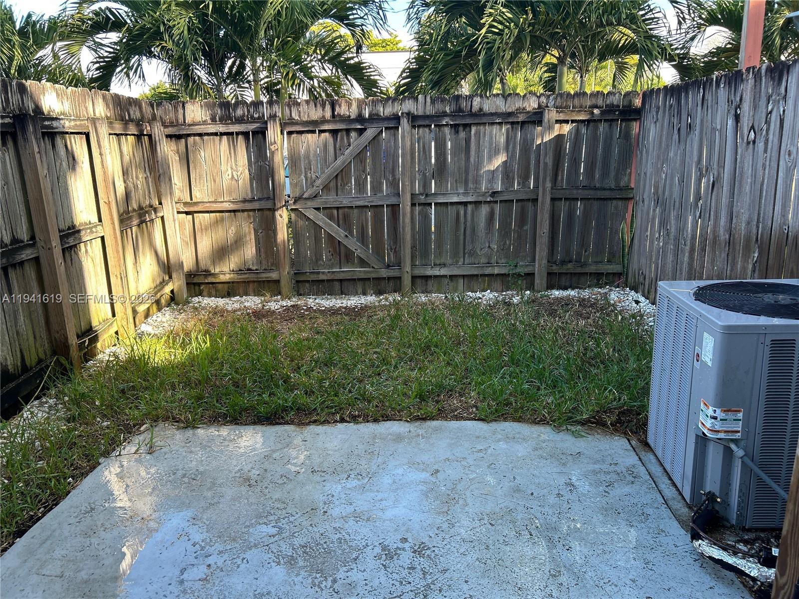 15103 Southwest 81st Street, Unit 213 Miami, FL 33193 - Photo 13 of 13 a backyard of a house with lots of green space