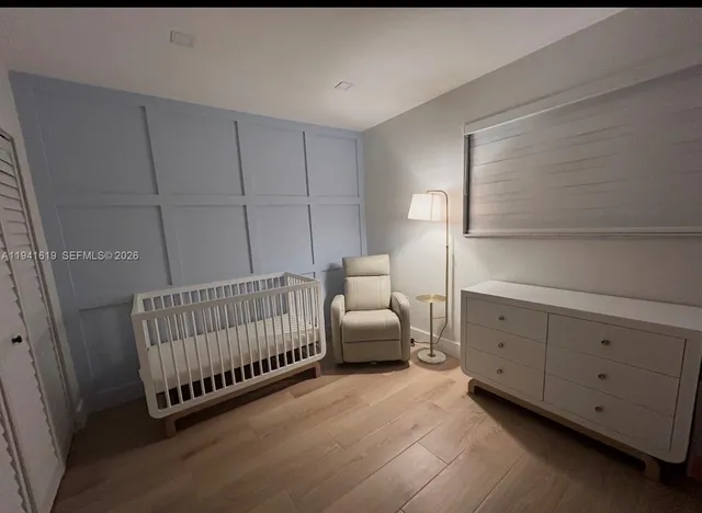 a bedroom with furniture and a window