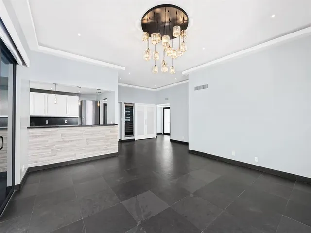 a view of a room with a chandelier