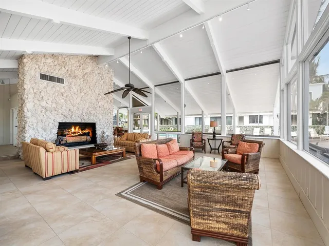 a outdoor living space with patio furniture and a fireplace