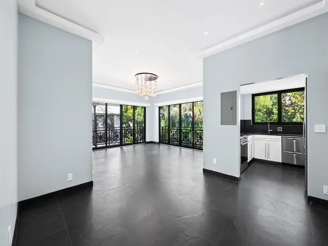 a view of a furniture and wooden floor in a room