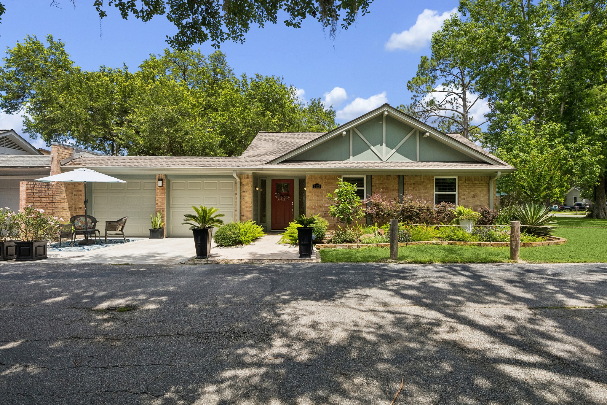 2102 Casa Rio Circle Dickinson, TX 77539 - Photo 1 of 22 Experience the charm of waterfront-community living at 2102 Casa Rio Circle. Surrounded by mature trees and thoughtfully landscaped grounds, this extensively renovated single-story residence offers outstanding curb appeal, remarkable privacy, and access to the community's waterfront amenities and scenic outdoor spaces. Oversized 2 car garage & private 2 car driveway. ***Bonus ~ Roof Replaced In 2024 ~ Exterior Repainted ~ Driveway Resurfaced ~ Front Door Replaced***