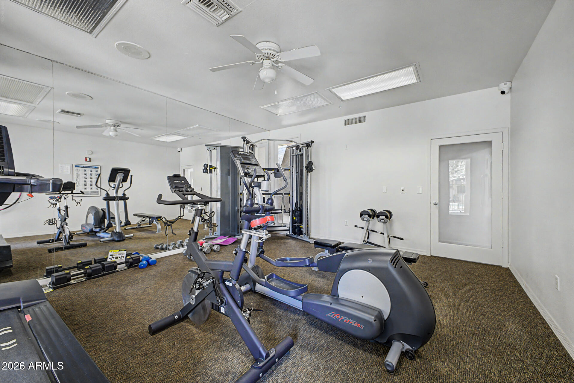 1295 North Ash Street, Unit 828 Gilbert, AZ 85233 - Photo 40 of 43 a room with gym equipment and mirror