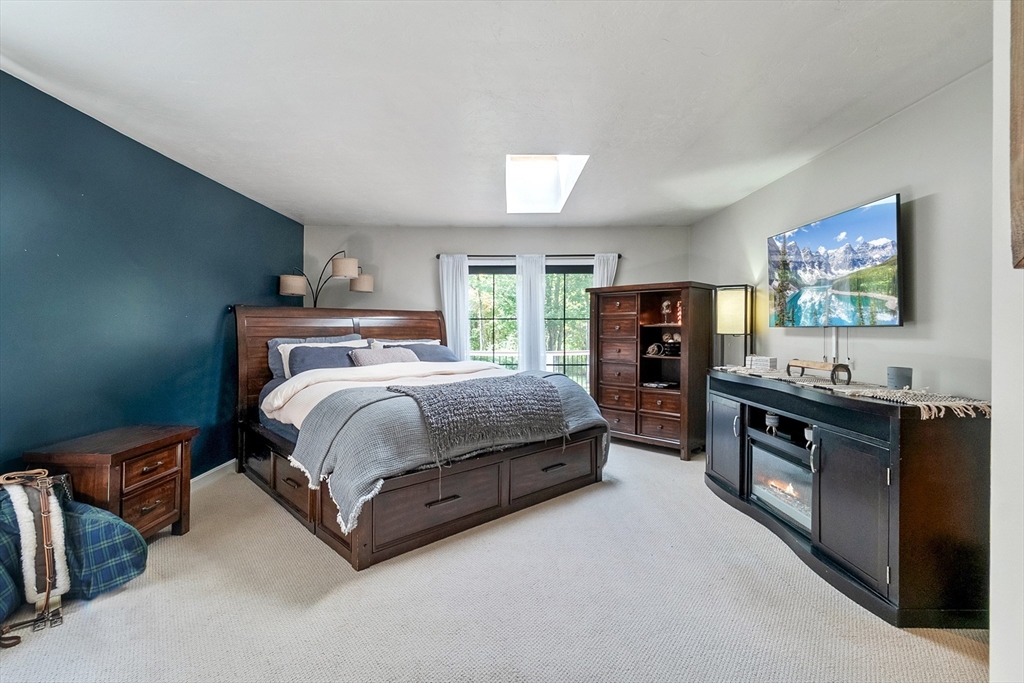 124 Wood Hill Road Monson, MA 01057 - Photo 18 of 41 a bedroom with a bed and a flat screen tv