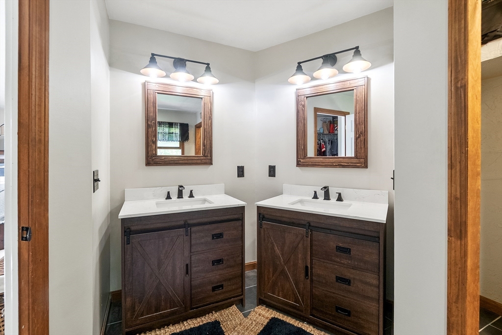 124 Wood Hill Road Monson, MA 01057 - Photo 20 of 41 a bathroom with double sink and two mirror