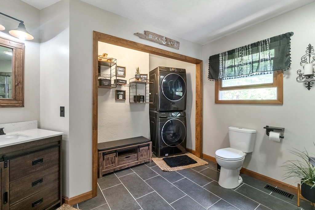 124 Wood Hill Road Monson, MA 01057 - Photo 22 of 41 a bathroom with a toilet a sink and a window