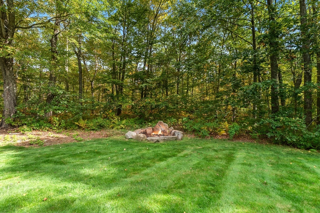 124 Wood Hill Road Monson, MA 01057 - Photo 36 of 41 a backyard of a house with lots of green space