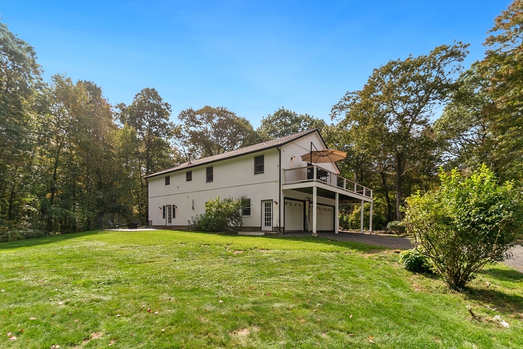 124 Wood Hill Road Monson, MA 01057 - Photo 38 of 41 a front view of house with yard and green space