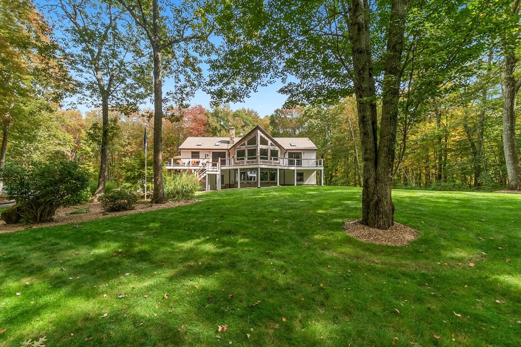 124 Wood Hill Road Monson, MA 01057 - Photo 4 of 41 a front view of a house with a garden