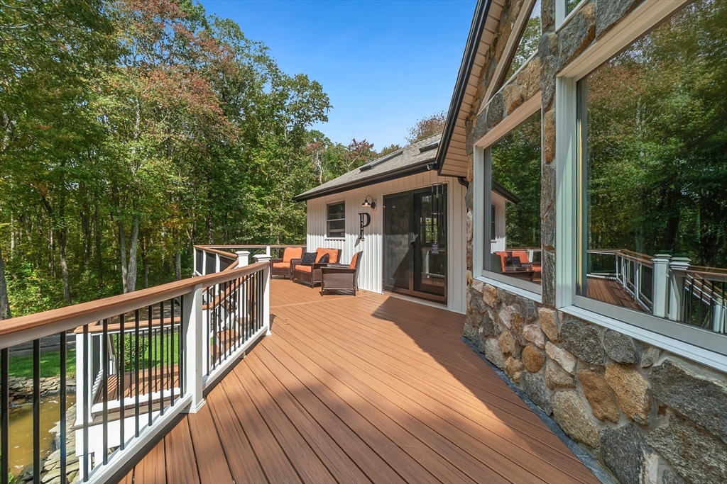 124 Wood Hill Road Monson, MA 01057 - Photo 5 of 41 a house view with a seating space and garden