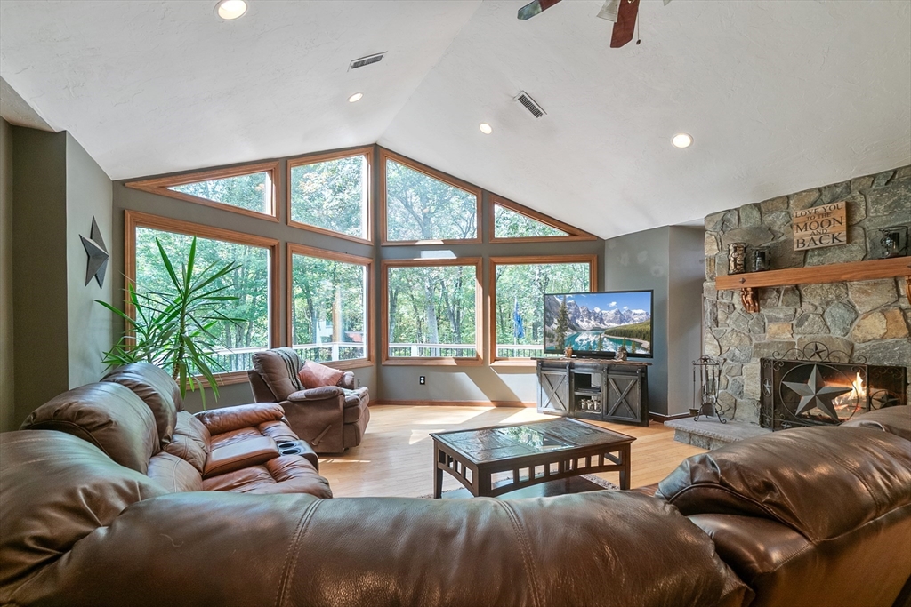 124 Wood Hill Road Monson, MA 01057 - Photo 9 of 41 a living room with furniture and a fireplace
