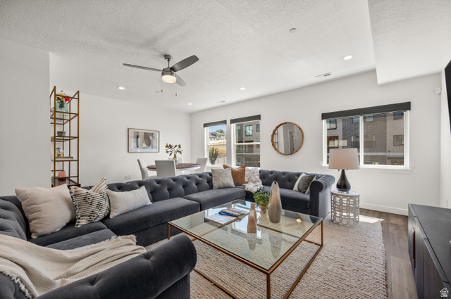 12241 900 East, Unit 7 Draper, UT 84020 - Photo 2 of 22 Open-concept living area with wood-finish flooring and ample natural light from multiple windows