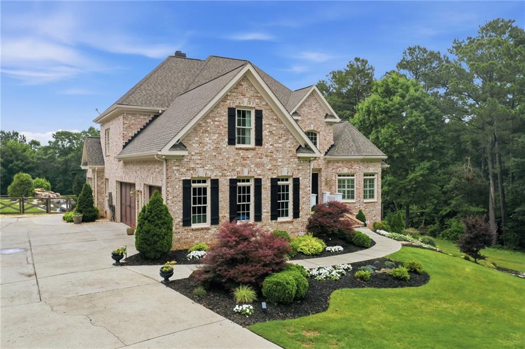 2950 Callie Still Road Lawrenceville, GA 30045 - Photo 4 of 77 a front view of a house with a yard