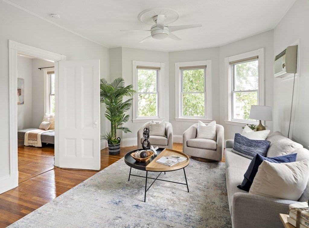 50 Beacon Street, Unit 3 Somerville, MA 02143 - Photo 3 of 15 a living room with furniture a window and a table