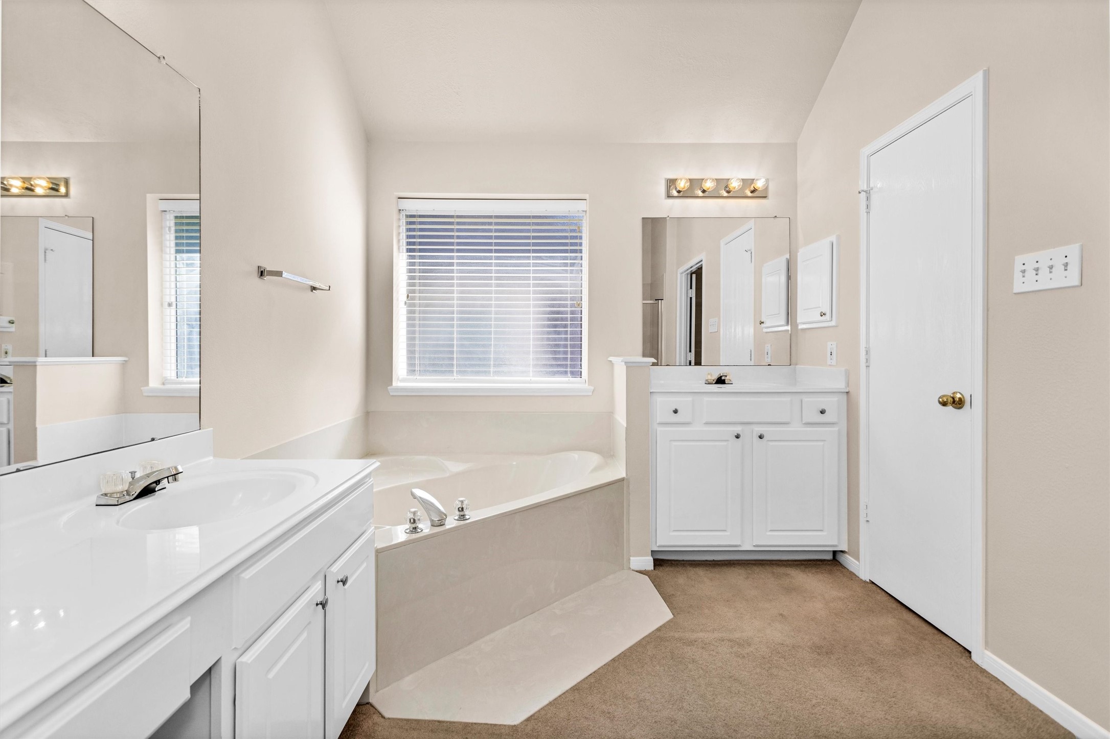 2615 Honeysuckle Walk Spring, TX 77388 - Photo 24 of 39 a spacious bathroom with a double vanity sink a mirror and a bathtub