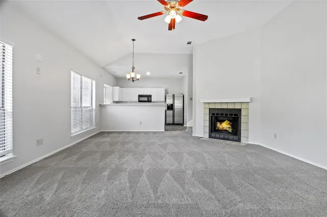 a view of an empty room with a fireplace