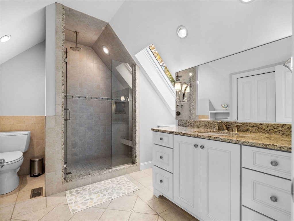 4 Farmer Road, Unit 4 Milton, MA 02186 - Photo 23 of 33 a bathroom with a granite countertop sink a toilet and shower