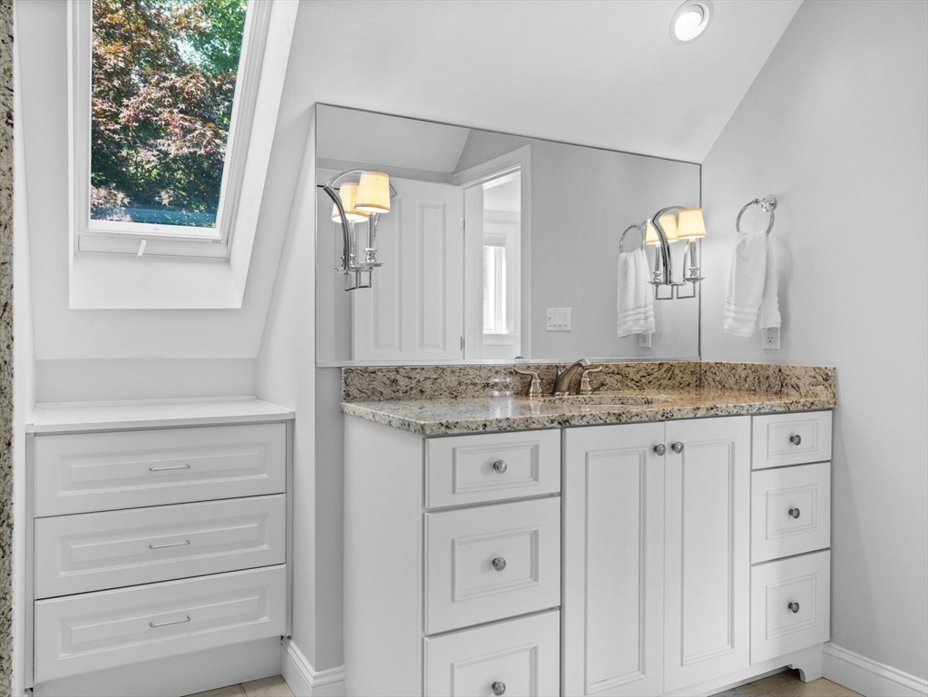 4 Farmer Road, Unit 4 Milton, MA 02186 - Photo 24 of 33 a bathroom with a granite countertop sink and a mirror