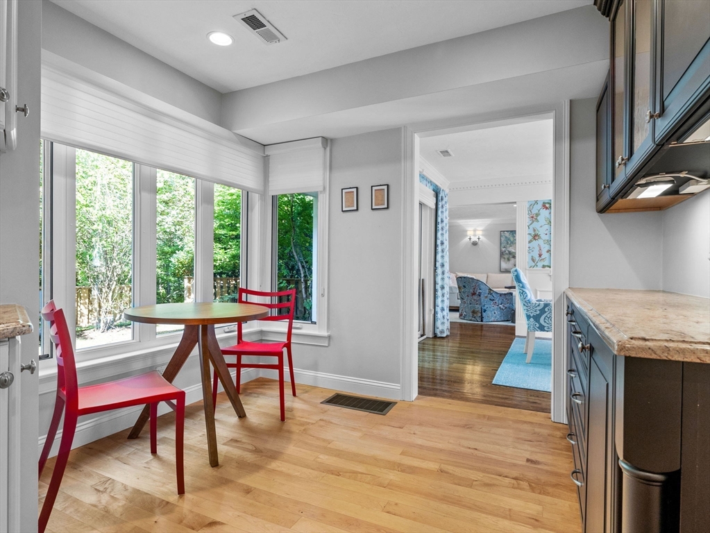 4 Farmer Road, Unit 4 Milton, MA 02186 - Photo 10 of 33 a workspace with furniture window and wooden floor