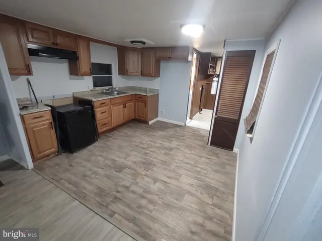 a kitchen with stainless steel appliances a refrigerator and a sink