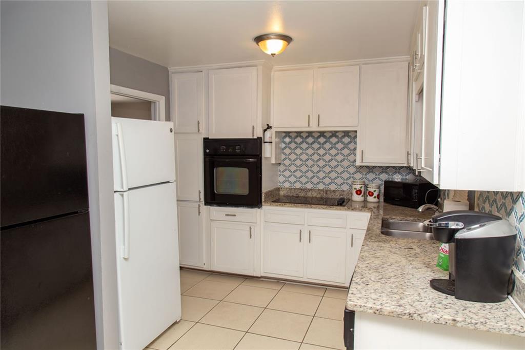 1681 Atherton Circle Decatur, GA 30035 - Photo 3 of 17 a kitchen with a sink and white cabinets