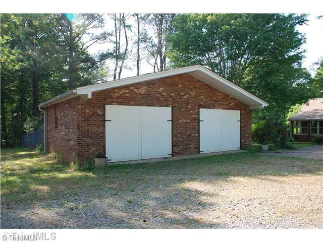 7174 Sapp Ridge Road Pfafftown, NC 27040 - Photo 6 of 16 Outbuilding. Garage / shop is 30 x 22 and equipped with 240 amp service. Doors are 9 5" wide and 80" high.