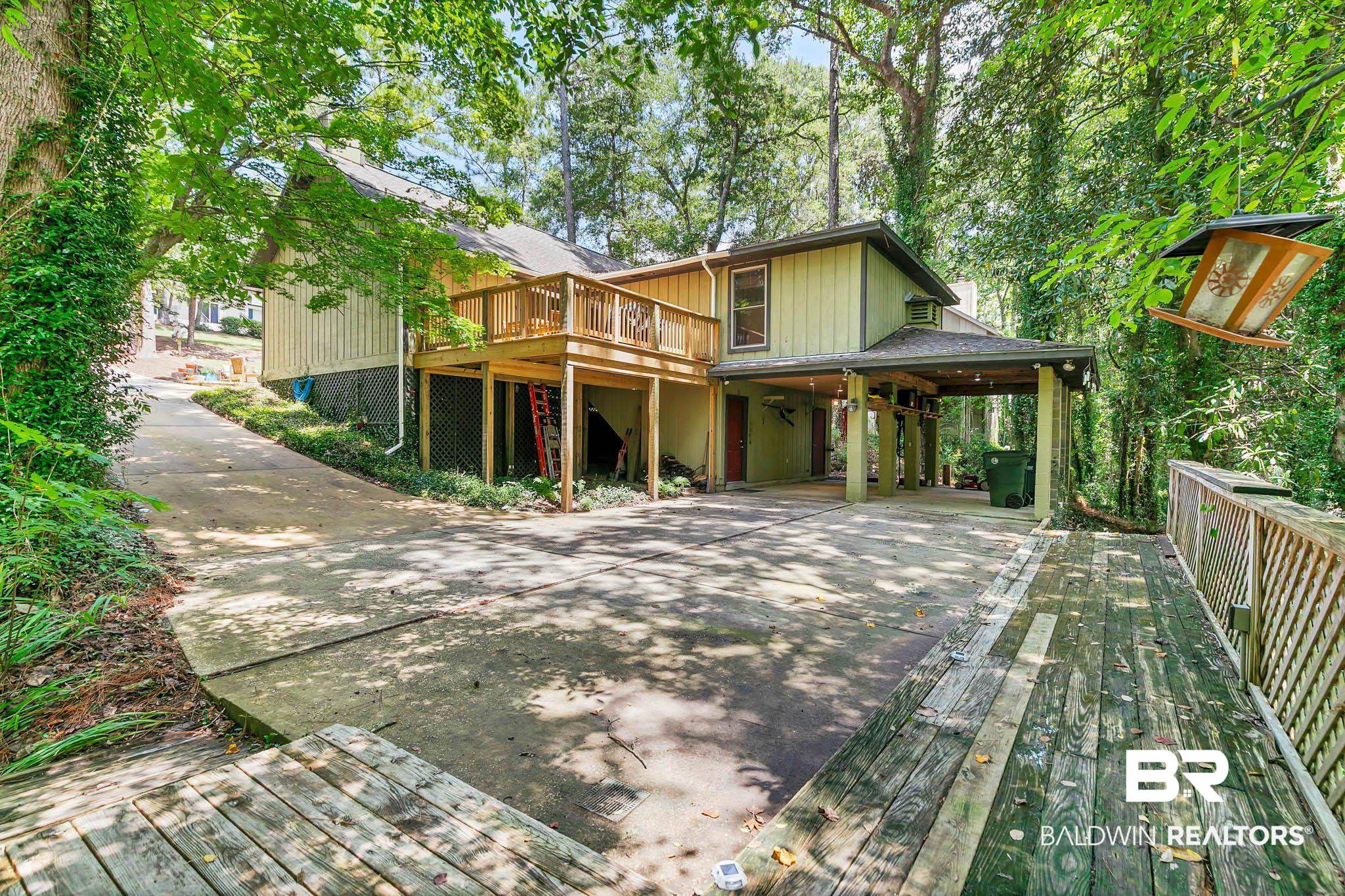 332 Ridgewood Drive Daphne, AL 36526 - Photo 36 of 48 View of front facade with a deck and concrete driveway