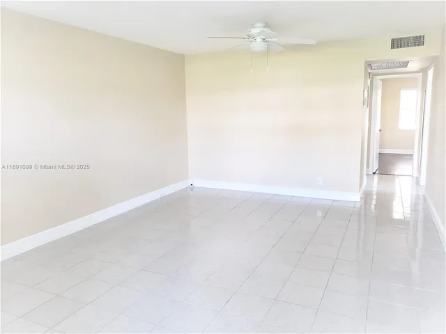 an empty room with a bathroom