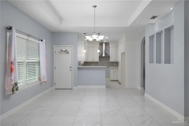 a view of a kitchen with a sink and dishwasher cabinet