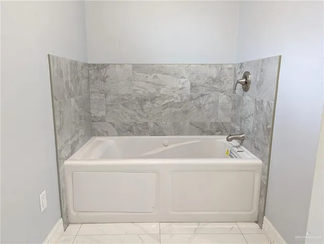 a bathroom with a bathtub