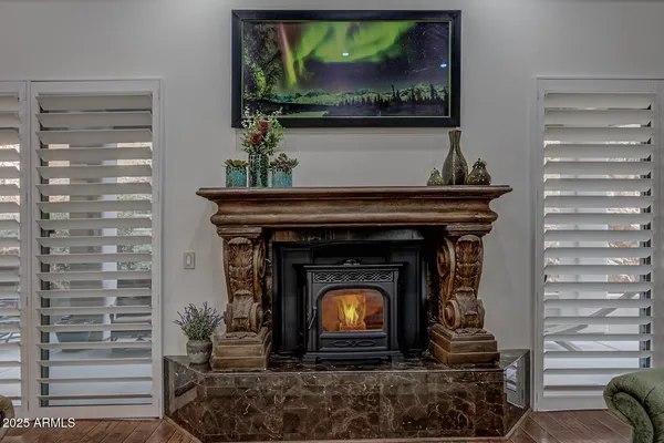 a living room with a fireplace and a fireplace
