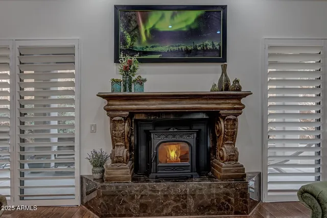 a living room with a fireplace and a fireplace