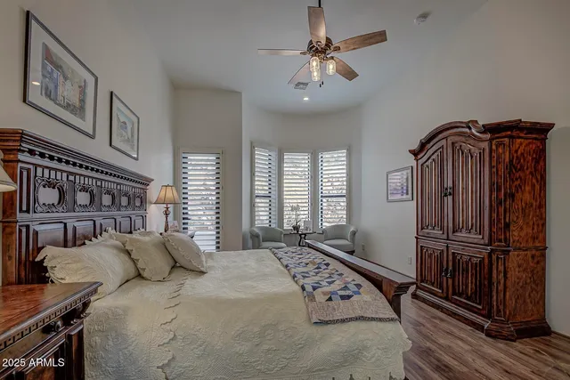 a bathroom with a granite countertop sink mirror vanity and toilet